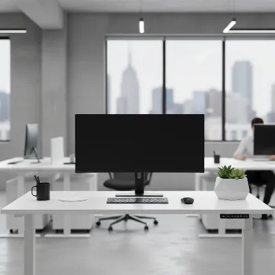 A sleek, minimalist office featuring a laminate standing desk with a clean white finish, alongside a monitor and modern accessories.